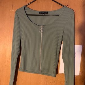 a light green long sleeve